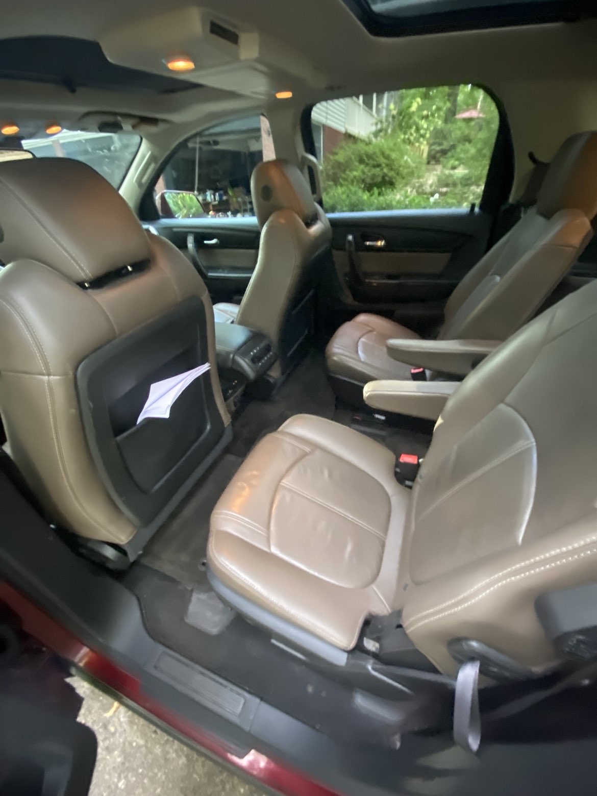 Cleaned second-row leather seats and carpets in a GMC Acadia